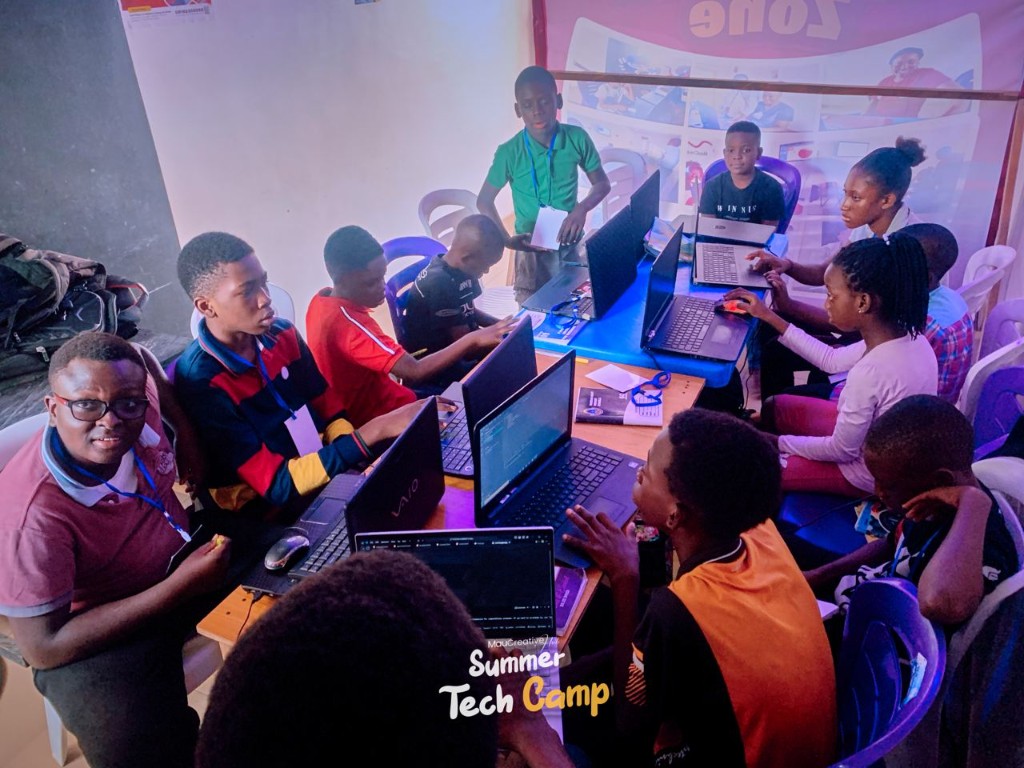 Summer Tech Camp in Calabar with students working on laptops together