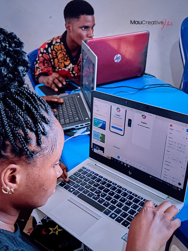 Student designing a mobile app screen in Figma during a Mau Creative Hub training session